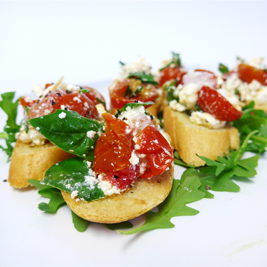 Bruschetta with basil pesto, blistered cherry tomato & feta (V)
