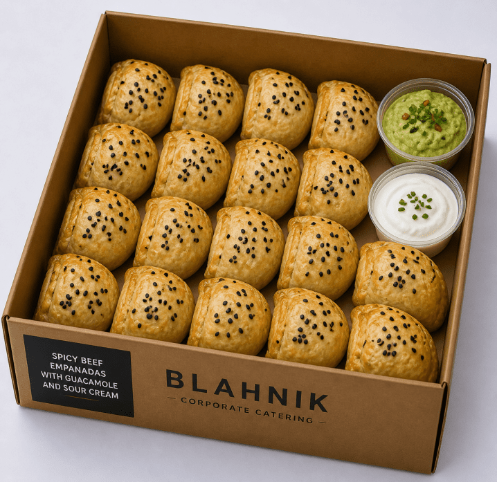 Spicy beef empanadas with guacamole and sour cream