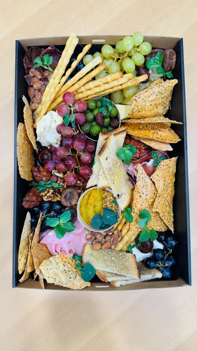 Charcuterie platter - prosciutto, salami, ham, mortadella, olives, mixed pickles, marinated vegetables, condiments, crackers and lavosh