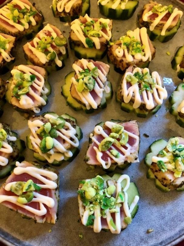 Seared tuna on cucumber rounds - garnish may vary