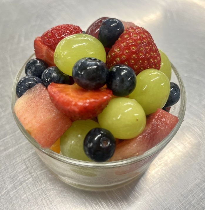 Fruit salad cup, seasonal sliced fruit and berries