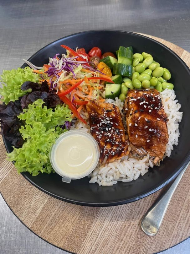 Soy, chili sesame Glory Bay salmon bento bowl, with fluffy seasoned rice, kewpie mayo and seasonal salad