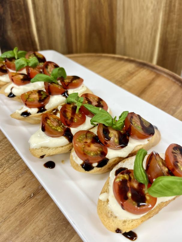  Fresh cherry tomato and basil, on house bruschetta with whipped Zany Zeuss feta 