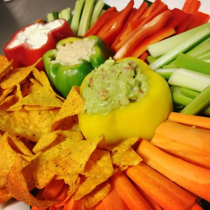 Gourmet dip selection with fresh cut vegetables & organic corn chips