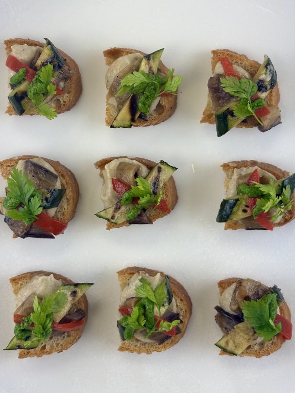 Smoked babaganoush bruschetta w grilled vegetables & pesto (V)