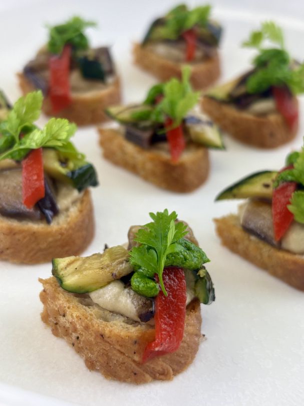 Smoked babaganoush bruschetta w grilled vegetables & pesto (V)