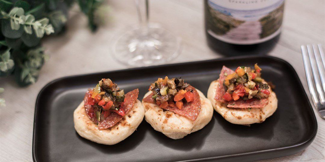 Mini Pizzetta of salami & chopped antipasto veg & bocconcini
