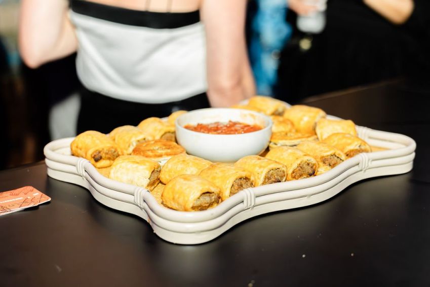 Homemade mini beef sausage rolls with relish